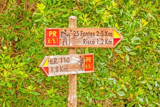 Signpost showing the way to 25 Fontes and Risco, famous walk trail for hikers on island of Madeira.