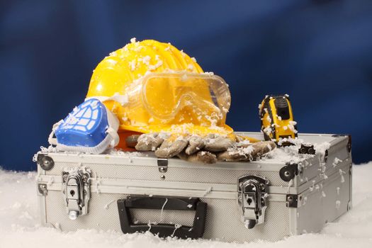 Safety New Year- protective equipment on artificial snow