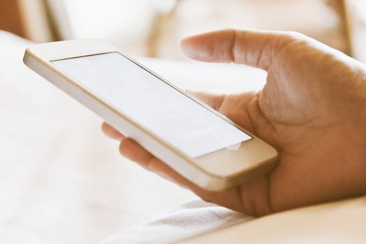 Woman hand holding a Smart Phone background