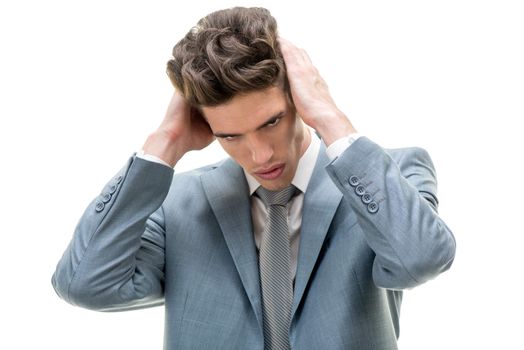 Portrait of stressed businessman holding his head and facing business problems. White background.