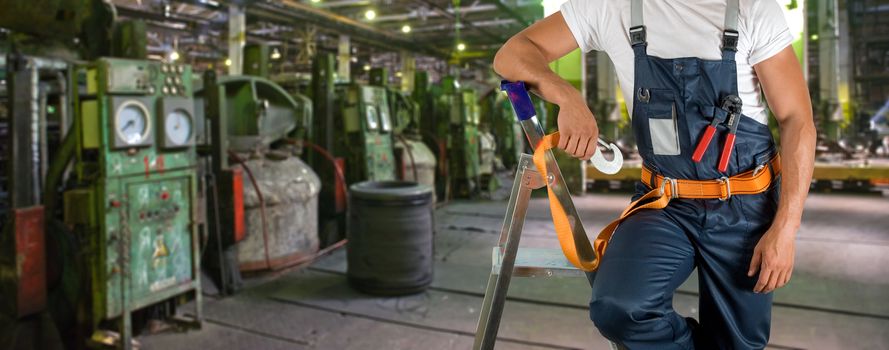 Worker with instruments at industrial factory