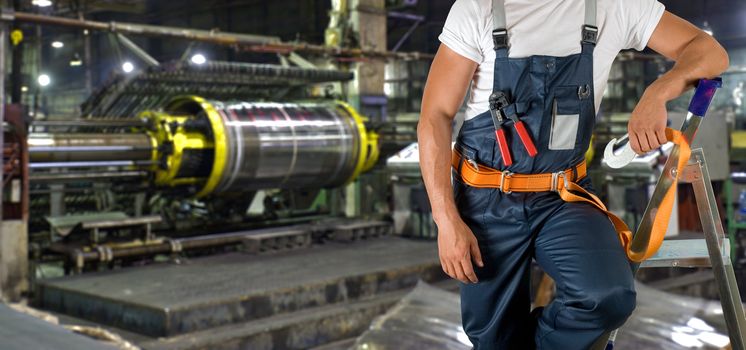 Worker with instruments at industrial factory