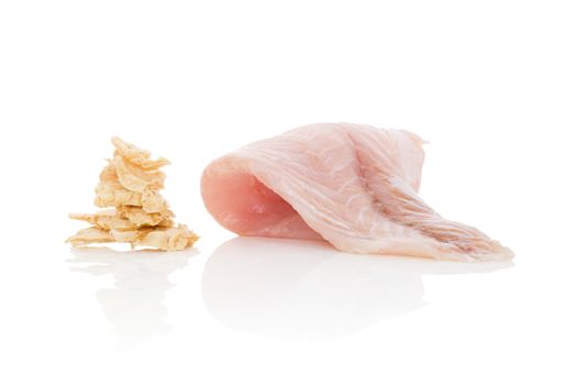 Fresh catfish fillet and dry fish chips isolated on white background. Culinary healthy seafood eating. 