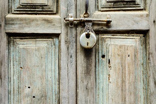 Old wooden door shut with a lock in Kathmandu, Nepal