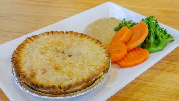 Chicken pot pie with carrot and broccoli