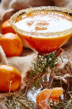 Fresh juice of ripe mandarins in glass. selective focus