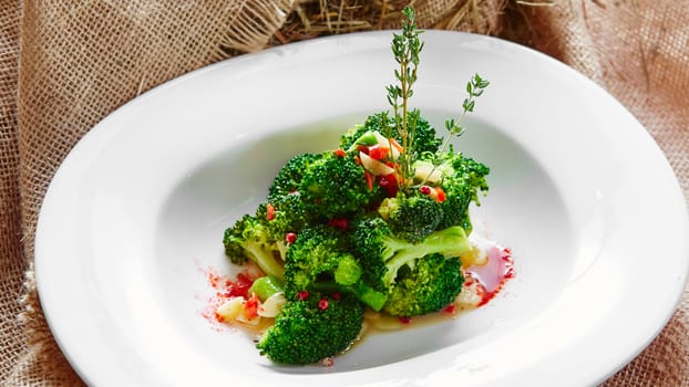 boiled broccoli in white bowl on table