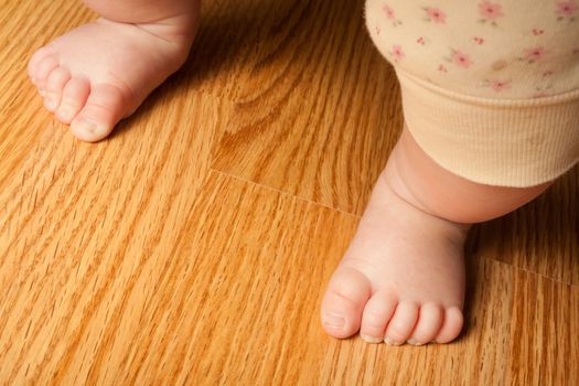 Little girl standing ready to take her first steps