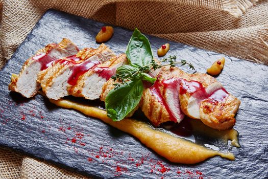 Grilled chicken breast with polenta and fresh vegetables