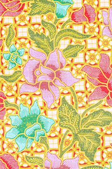 flower pattern background on batik fabric thai style.