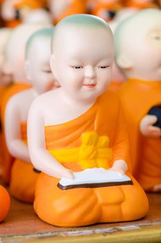 Many ceramic monk doll at temple in Thailand.