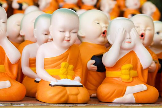 Many ceramic monk doll at temple in Thailand.