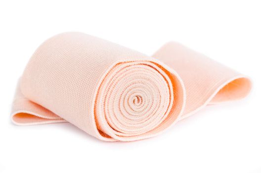 Medical bandage roll on white background.