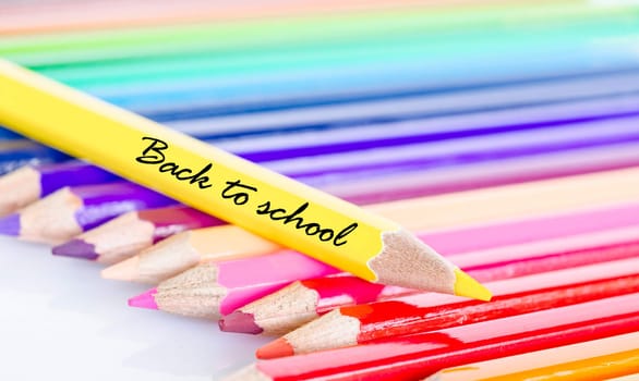 Colorful pencil crayons on a white background, Back to school.