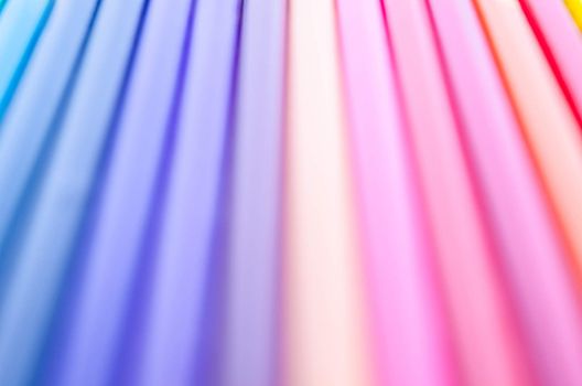 colorful background with soft faded rainbow-colored vertical stripes