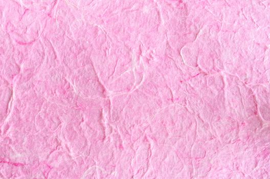 Pink paper background with fiber structure. Recycle paper.