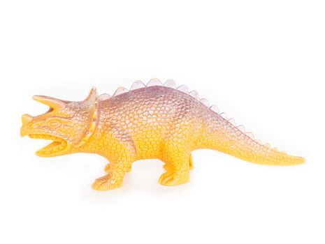 Plastic dinosaur toy on white background