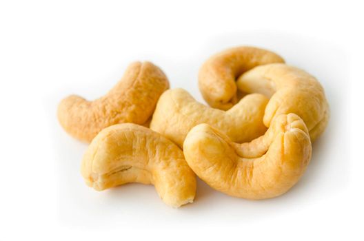 a pile of cashews isolated in a white background