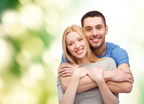love and family concept - smiling couple hugging