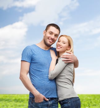 love and family concept - smiling couple hugging