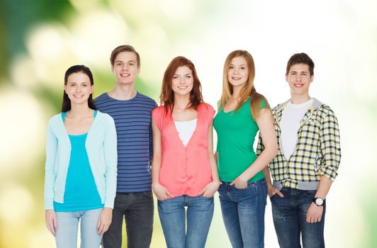 education and people concept - group of smiling students standing