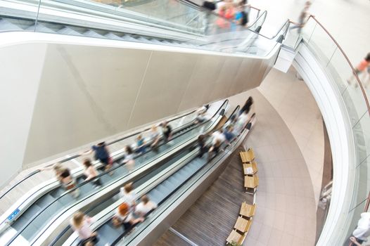 Modern shopping mall. Crowd of people on the escalator.