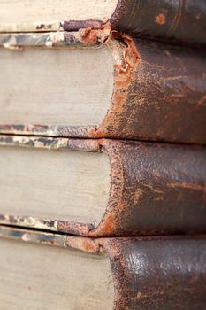 Library concept. Closeup of very old books stack