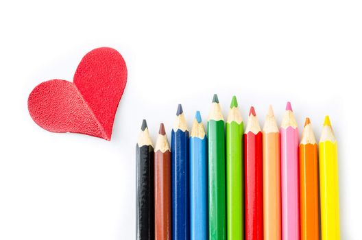 Many pencils color and red heart isolated on white background.