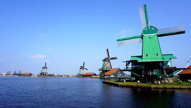 landscape of Windmills and river in holland