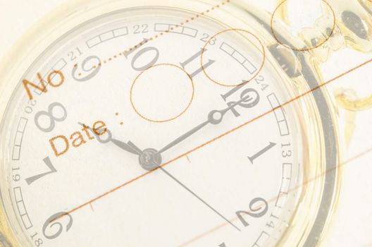 Time Business Concept. Gold pocket watch and close up diary background.