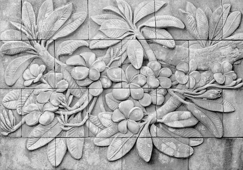 Low relief cement Thai style handcraft of plumeria or frangipani flowers