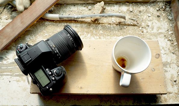 camera and coffee cup on site                               