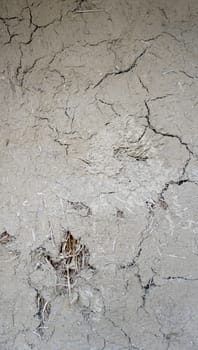 cracked texture on rough clay wall