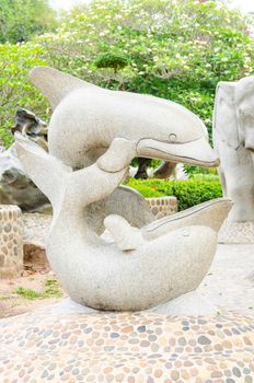 Twin Dolphin statue in garden