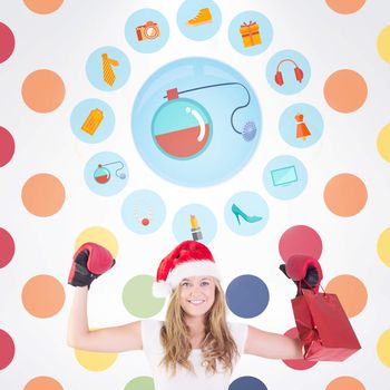 Festive blonde with boxing gloves and shopping bag against colorful polka dot pattern 