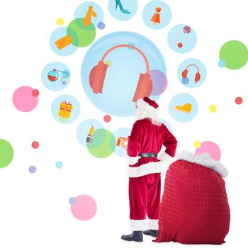 Happy santa with sack of gifts against dot pattern