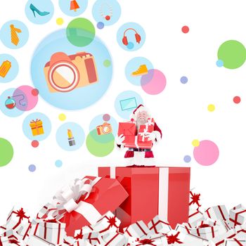 Santa standing in large gift against dot pattern