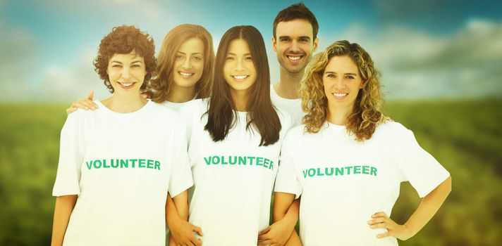 Group of people wearing volunteer tshirt against park