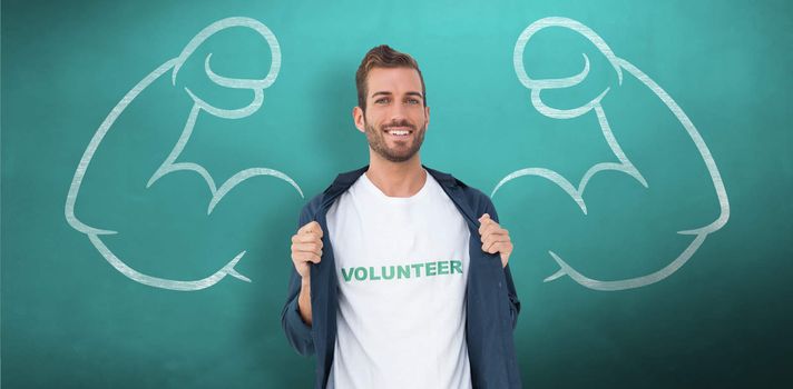 Portrait of a smiling young male volunteer against green chalkboard