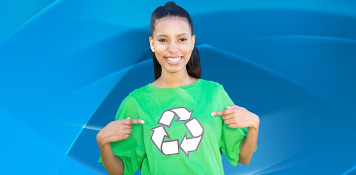 Happy environmental activist in the park against abstract blue design