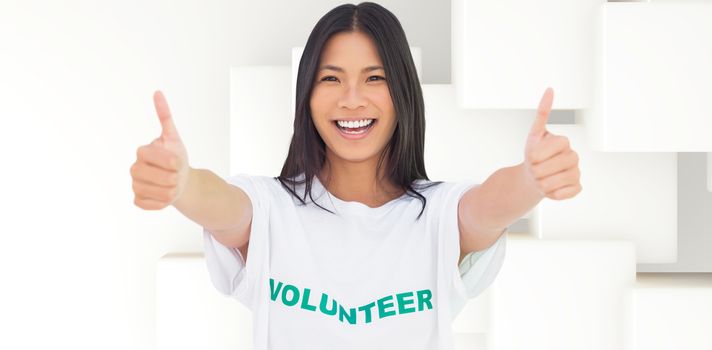 Woman wearing volunteer tshirt giving thumbs up against abstract white design
