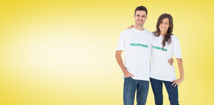 Two cheerful people wearing volunteer tshirt against yellow vignette