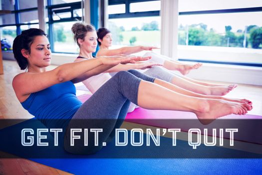 Women doing boat pose in yoga class against motivational new years message