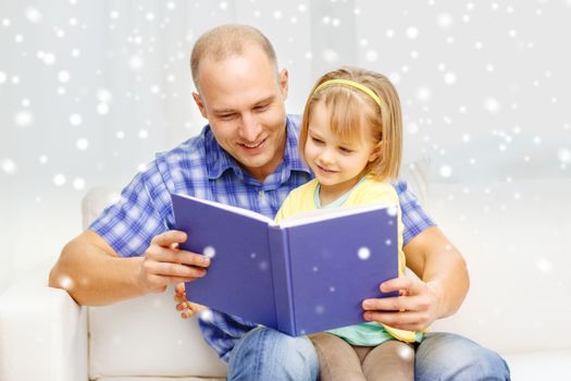 family, children, education and happy people concept - smiling father and daughter reading book at home