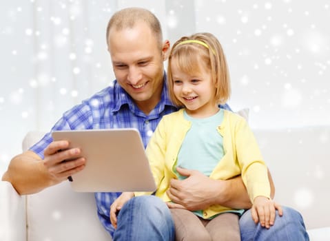 family, children, technology and people concept - happy father and daughter with tablet pc computer at home