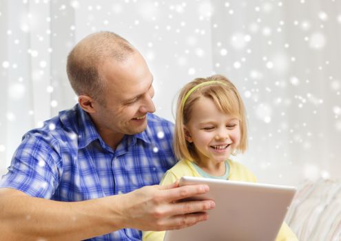 family, children, technology and people concept - happy father and daughter with tablet pc computer at home