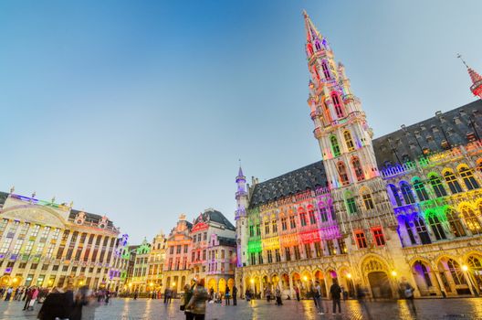 Brussels, Belgium - May 13, 2015: Tourists visiting famous Grand Place (Grote Markt) the central square of Brussels. The square is the most important tourist destination and most memorable landmark in Brussels. 