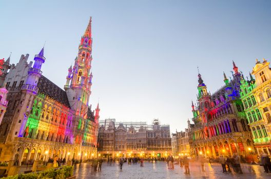 Brussels, Belgium - May 13, 2015: Tourists visiting famous Grand Place the central square of Brussels. The square is the most important tourist destination in Brussels. 