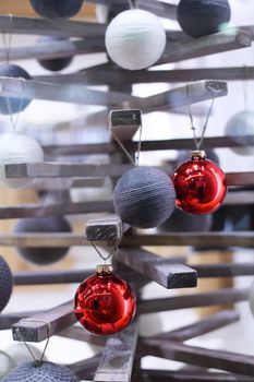 Modern wooden decorative Christmas tree with baubles
