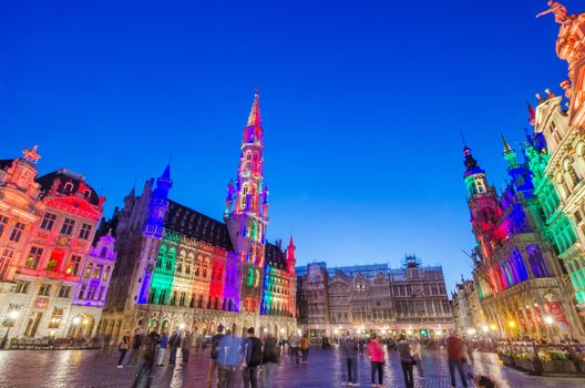 Brussels, Belgium - May 13, 2015: Tourists visiting famous Grand Place (Grote Markt) the central square of Brussels. The square is the most important tourist destination and most memorable landmark in Brussels. 